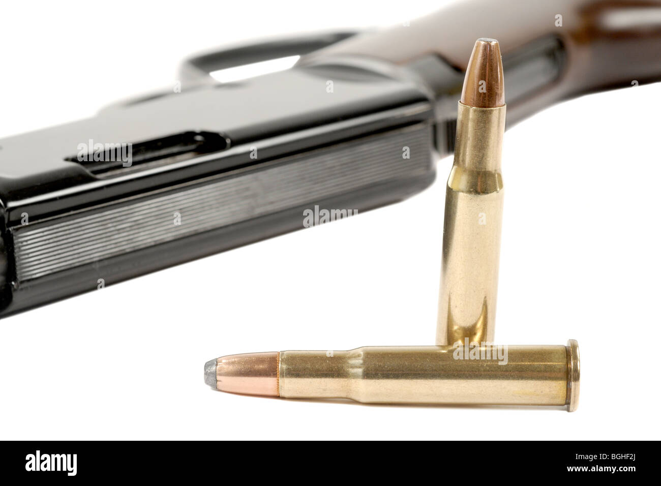 Macro shot of two bullets and a rifle Stock Photo
