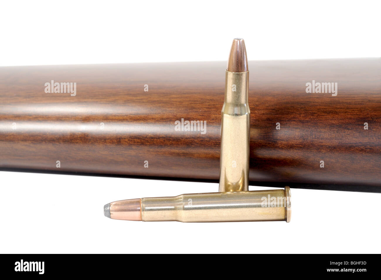 Macro shot of two bullets and a rifle stock Stock Photo