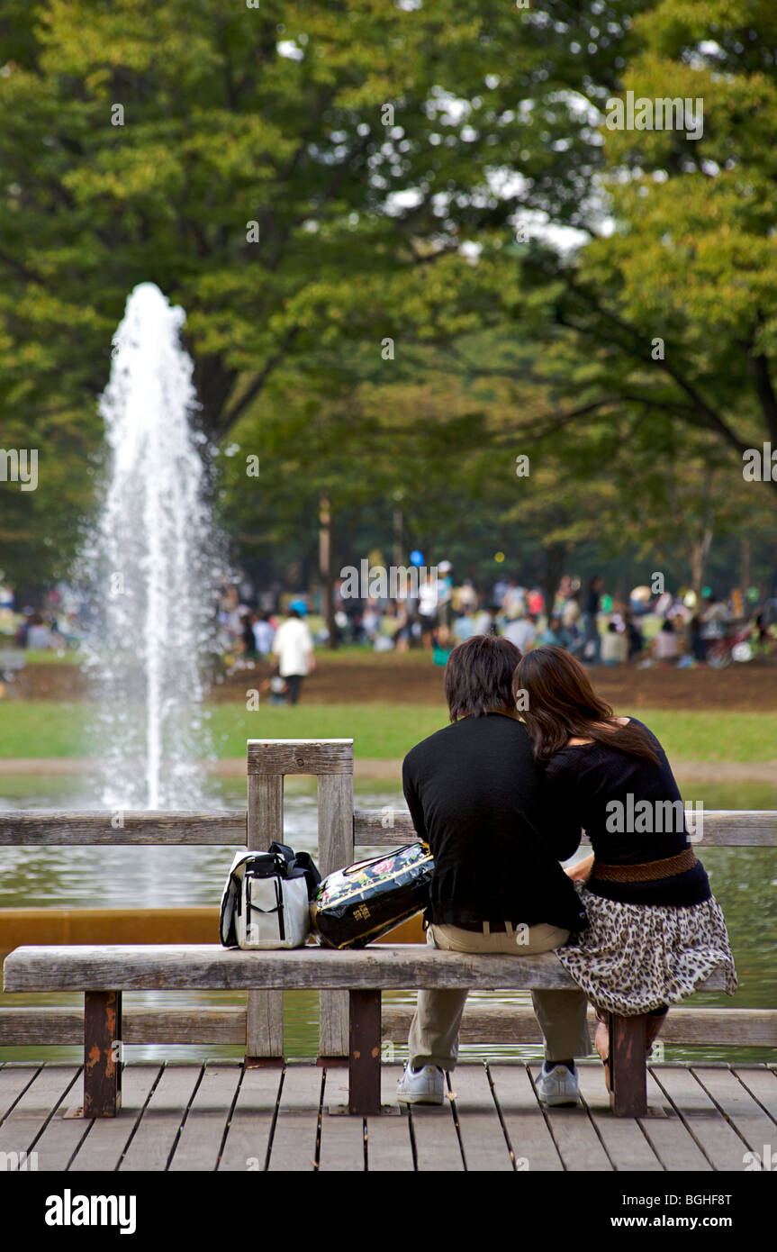 Couple enjoying Saturday afternoon in Yoyogi Park,  Harajuku, Tokyo, Japan Stock Photo