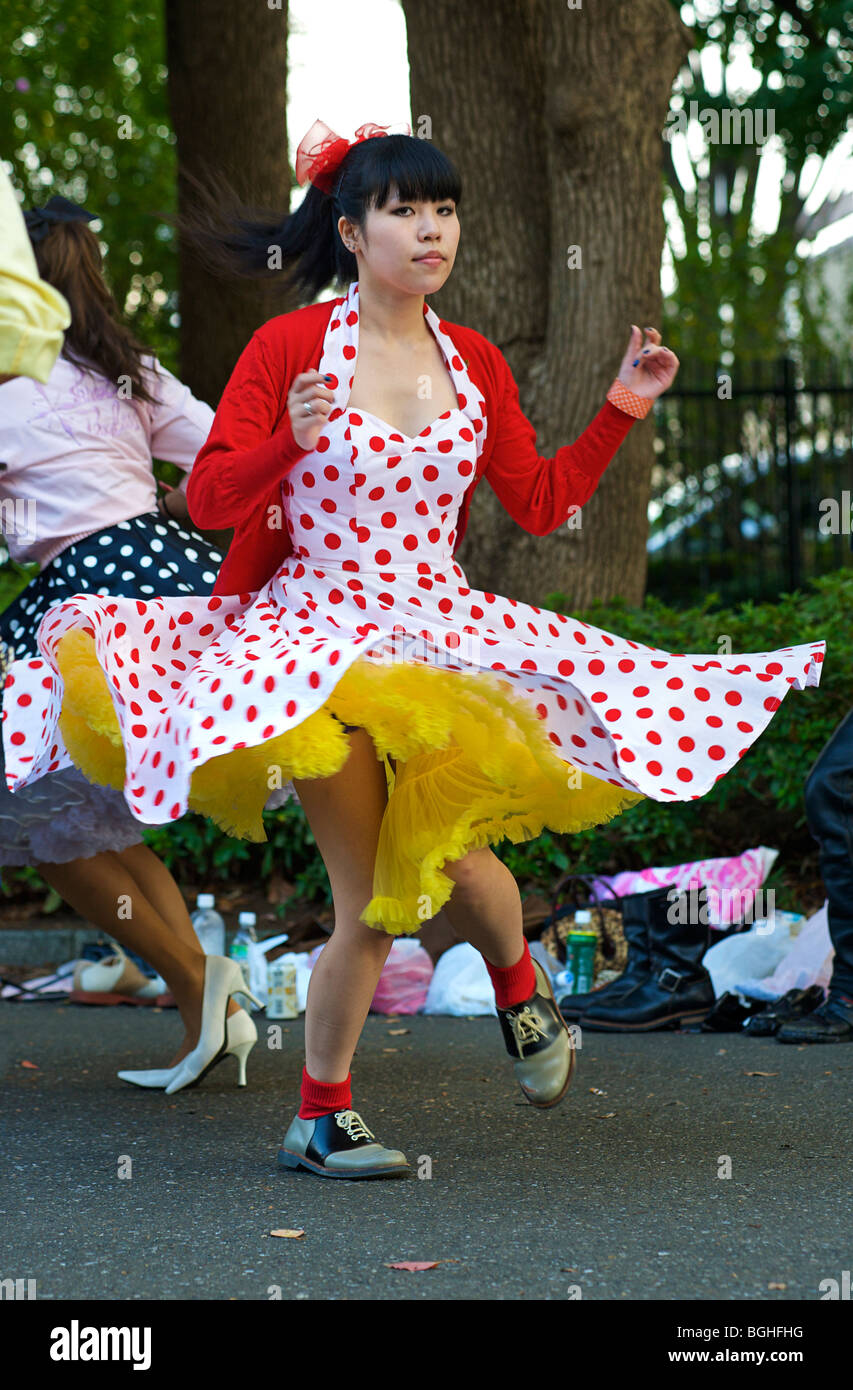 Young rockabilly girl dancing in Yoyogi Park,  Harajuku, Tokyo, Japan Stock Photo