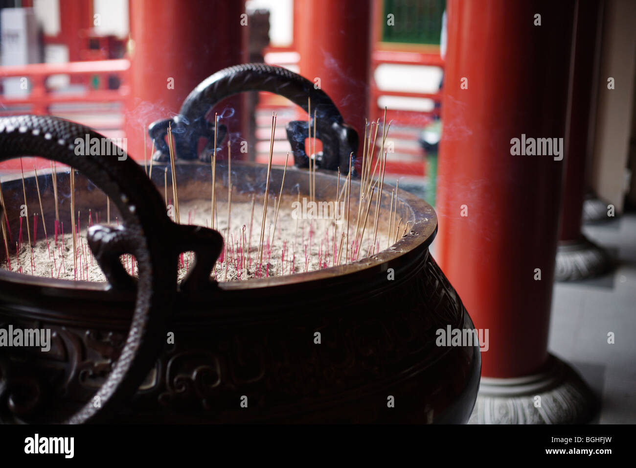Incense sticks burning outside a Buddhist temple in Singapore Stock