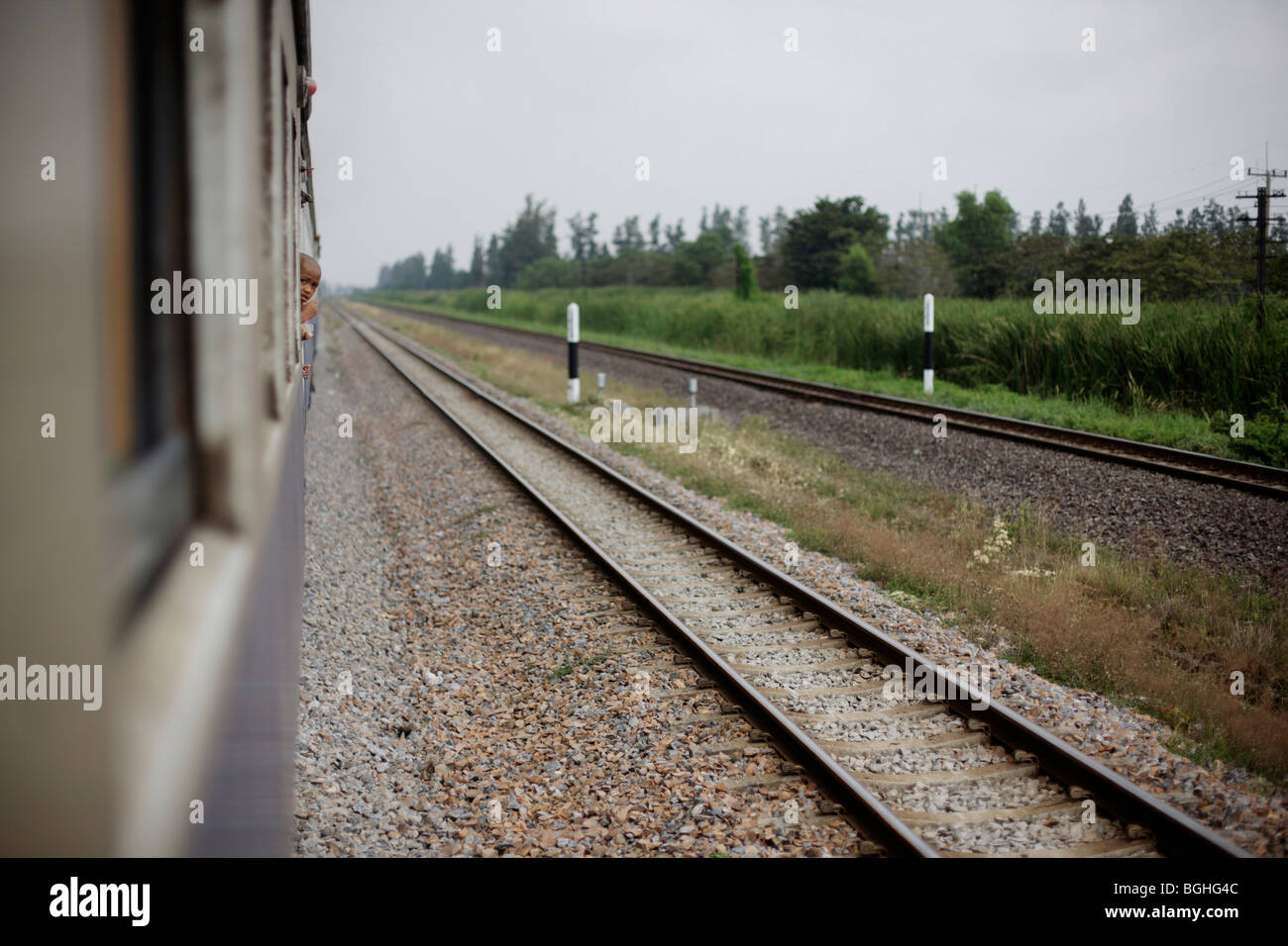 A train in motion in Thailand Stock Photo