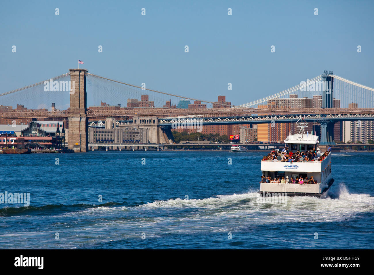 Tourists on a boat tour in the East River in New York City Stock Photo