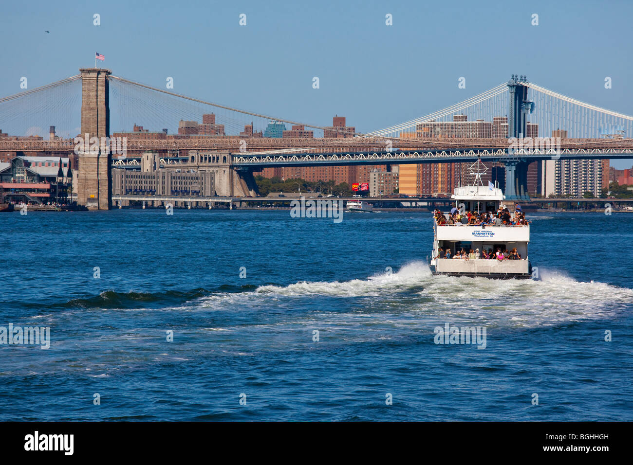 Tourists on a boat tour in the East River in New York City Stock Photo