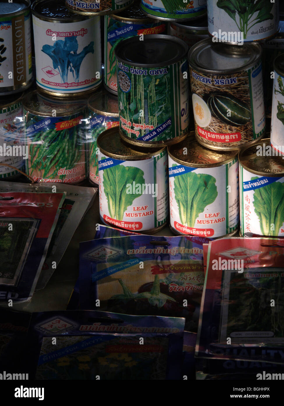 Tins of vegetables on a market stall in Thailand Stock Photo