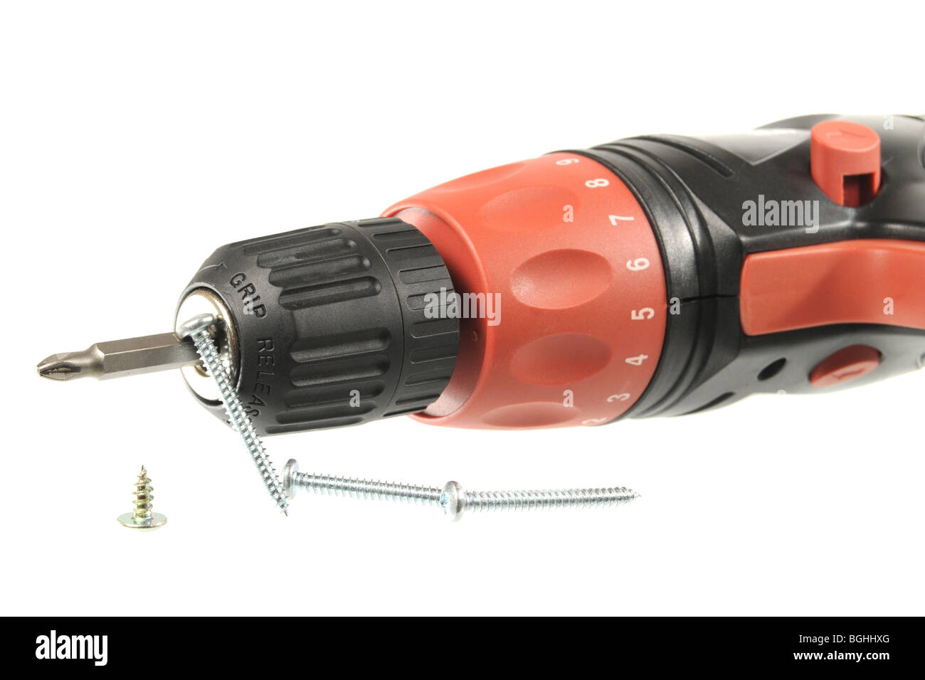 Cordless drill and screws isolated on a white background Stock Photo