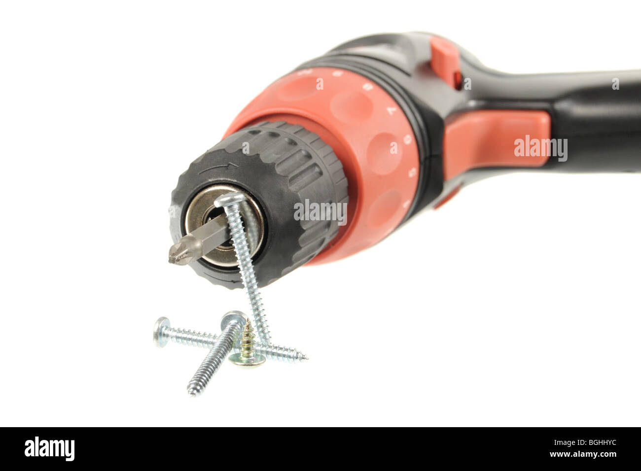 Cordless drill and screws isolated on a white background Stock Photo
