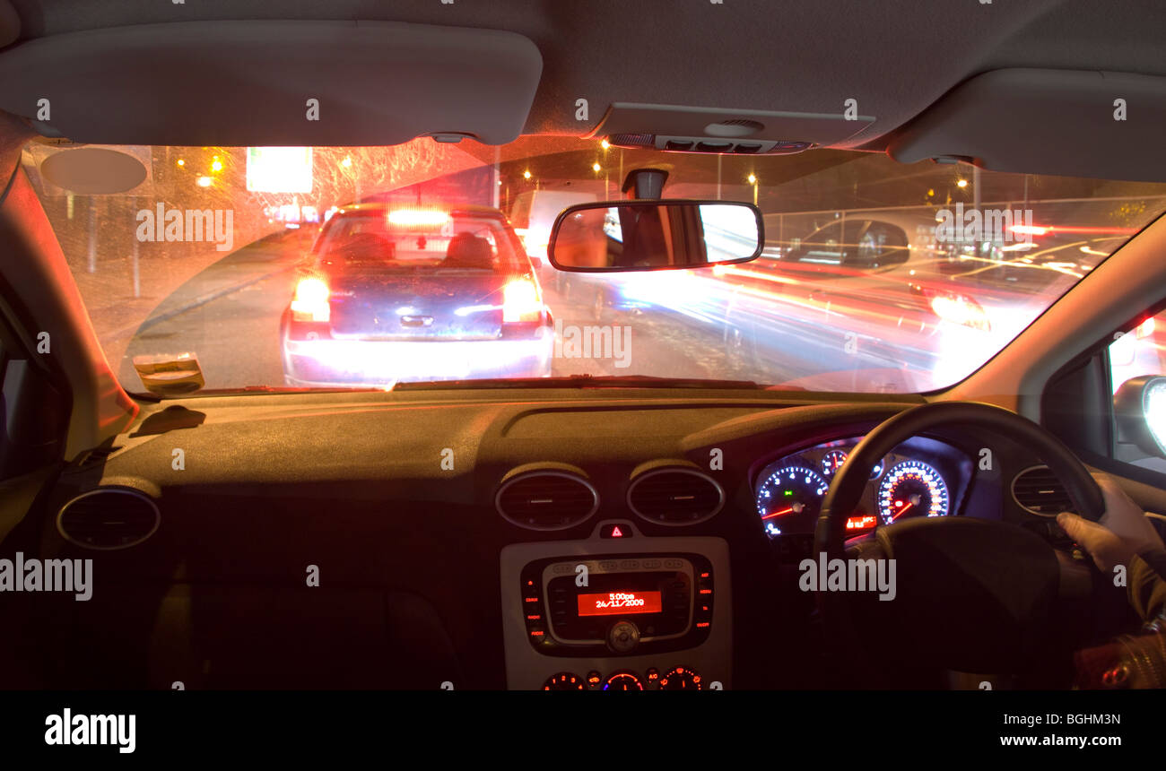 Interior of a car being driven at night Stock Photo