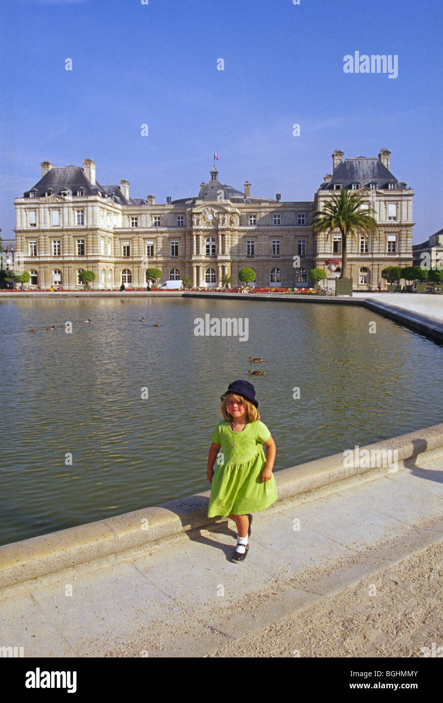 A four year old American girl tourist at the Luxembourg Gardens and Palace in Paris, France Stock Photo