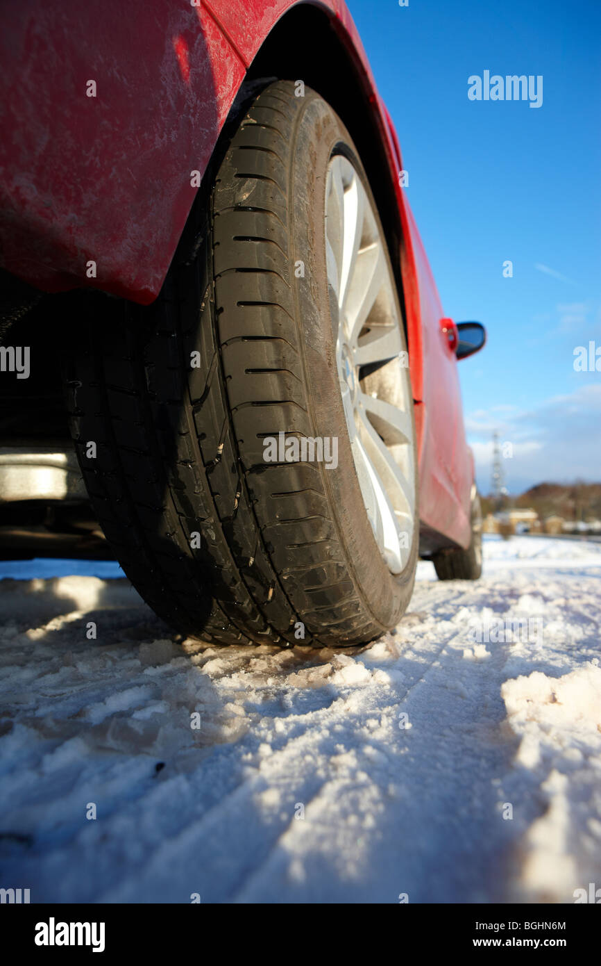 Close up of a Pirelli tyre and alloy wheel in the snow Stock Photo