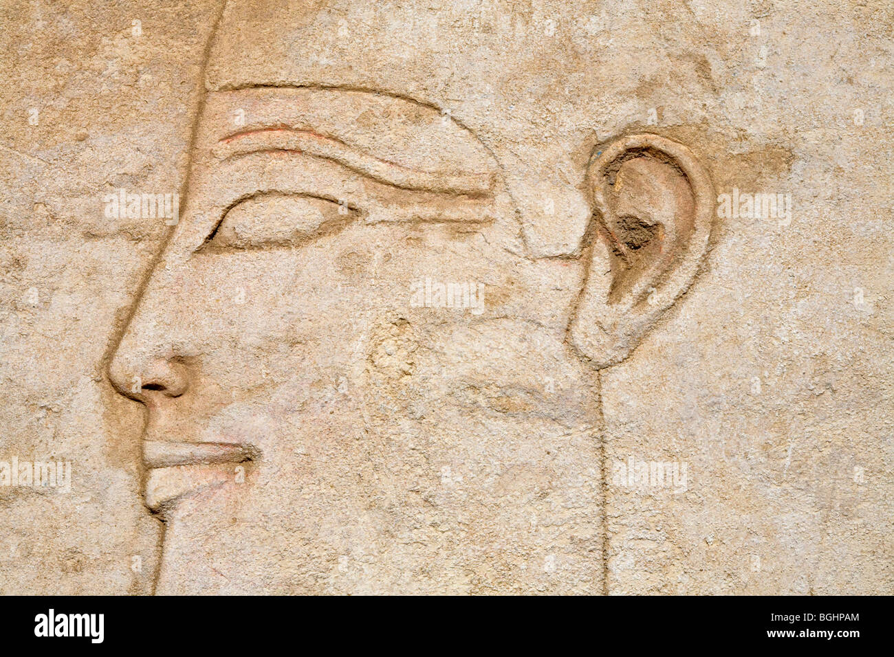 Close up of  carved relief of kings head on a block in the open-air Museum at Karnak Temple, Luxor Egypt Stock Photo