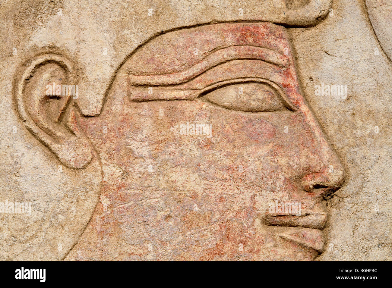 Close up of  carved relief of kings head on a block in the open-air Museum at Karnak Temple, Luxor Egypt Stock Photo