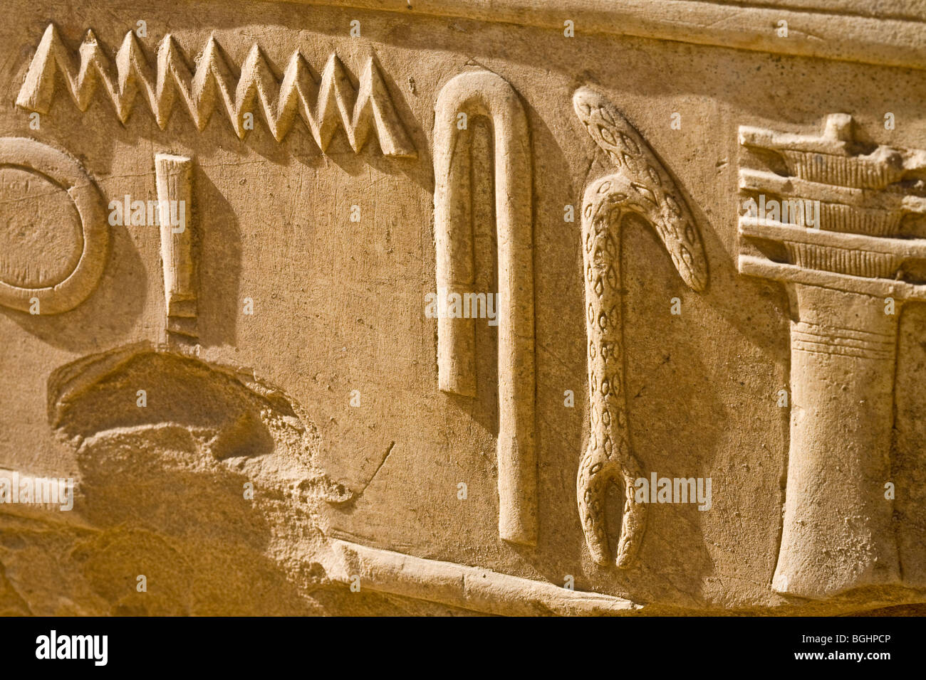 Close up of  carved relief of  hieroglyphs on a block in the open-air Museum at Karnak Temple, Luxor Egypt Stock Photo