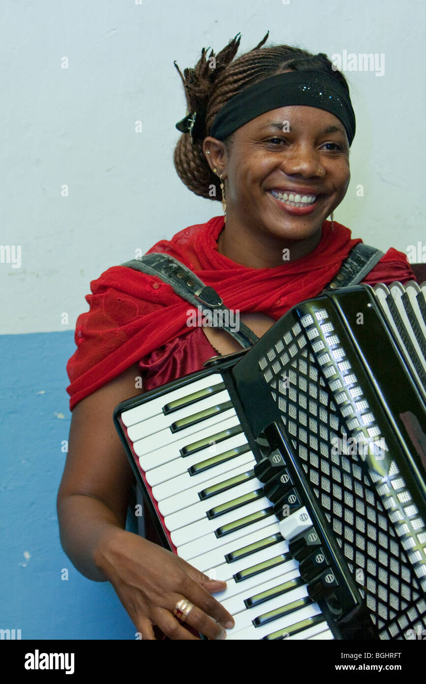 Zanzibar, Tanzania. Taarab Musicians. Culture Musical Club. Woman Playing Accordion. Note that she is wearing a nose pin. Stock Photo