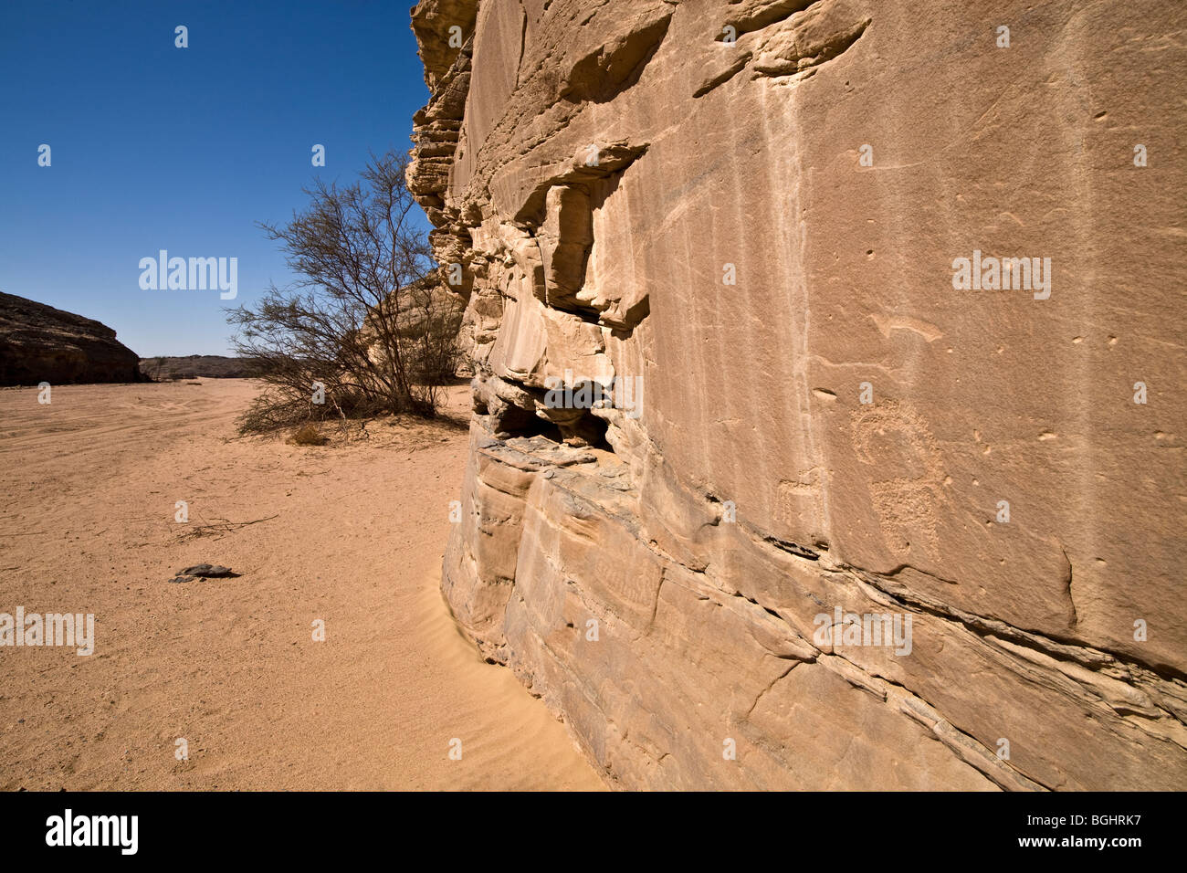 Wadi floor showing  rock face and ancient Rock-Art  in the Eastern Desert of Egypt. Stock Photo