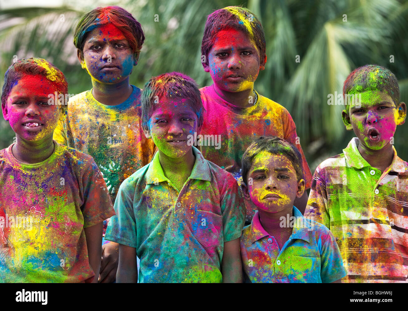 Young Indian boys covered in coloured powder pigment. India Stock Photo