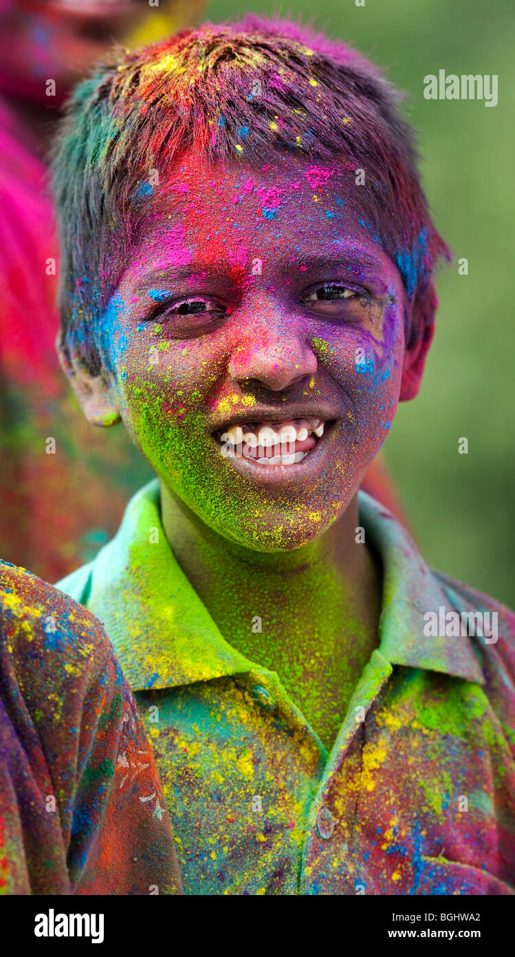 Young Indian boys covered in coloured powder pigment. India Stock Photo