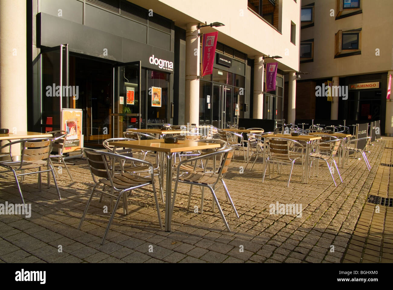 view of empty tables and chairs outside a cafe in coventry city centre