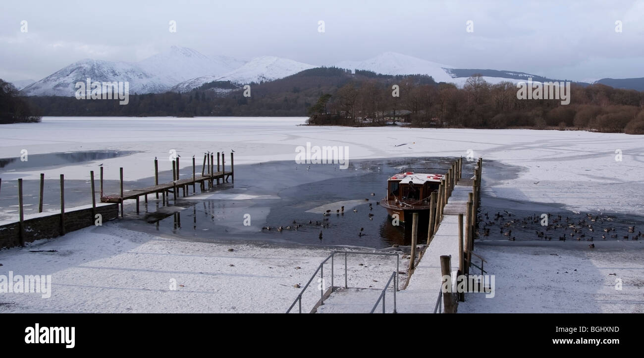 Boat trapped in the Frozen Derwent Water in Keswick, in the Lake District. Stock Photo