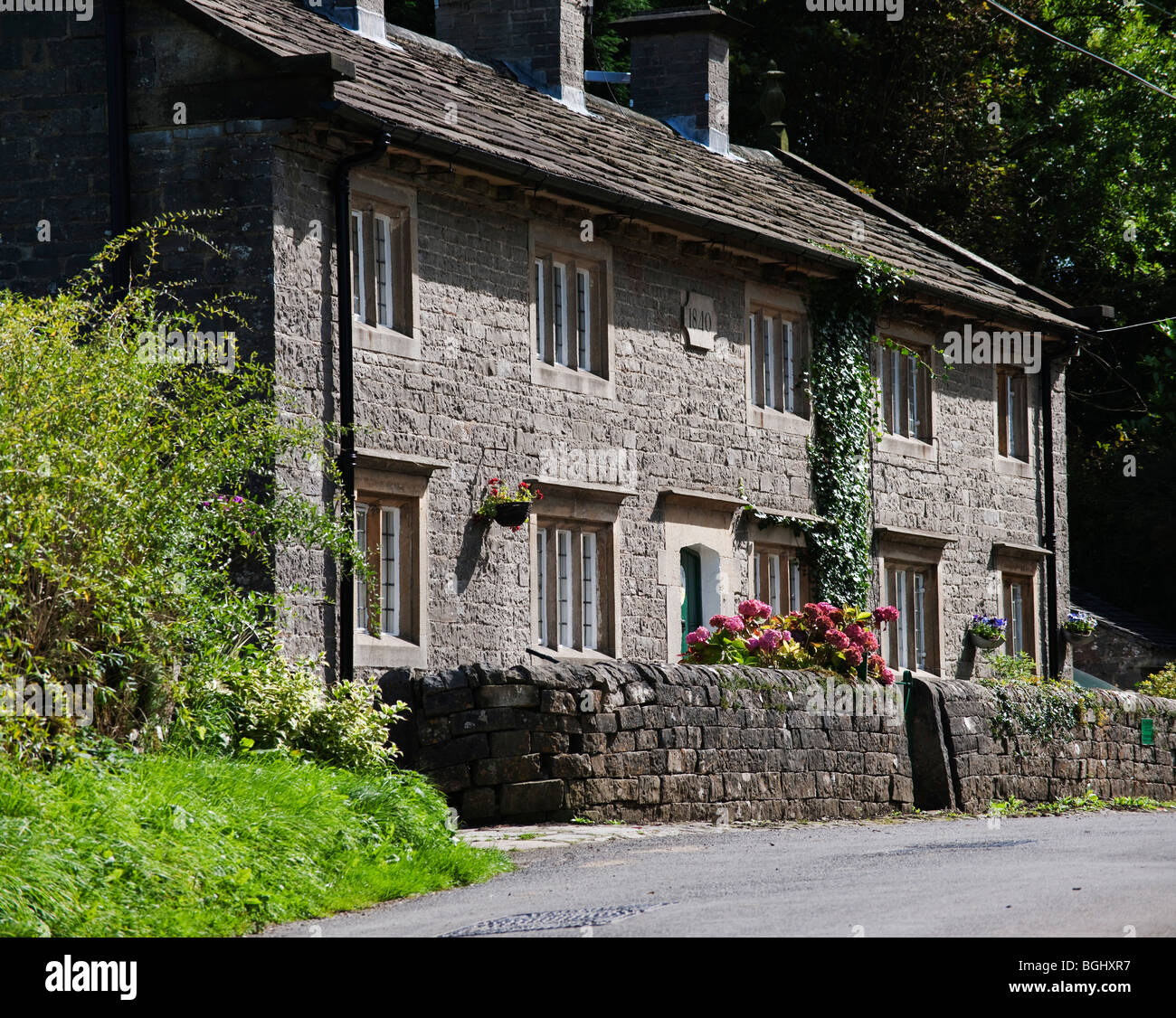 village with houses in countryside tissington, derbyshire, peak