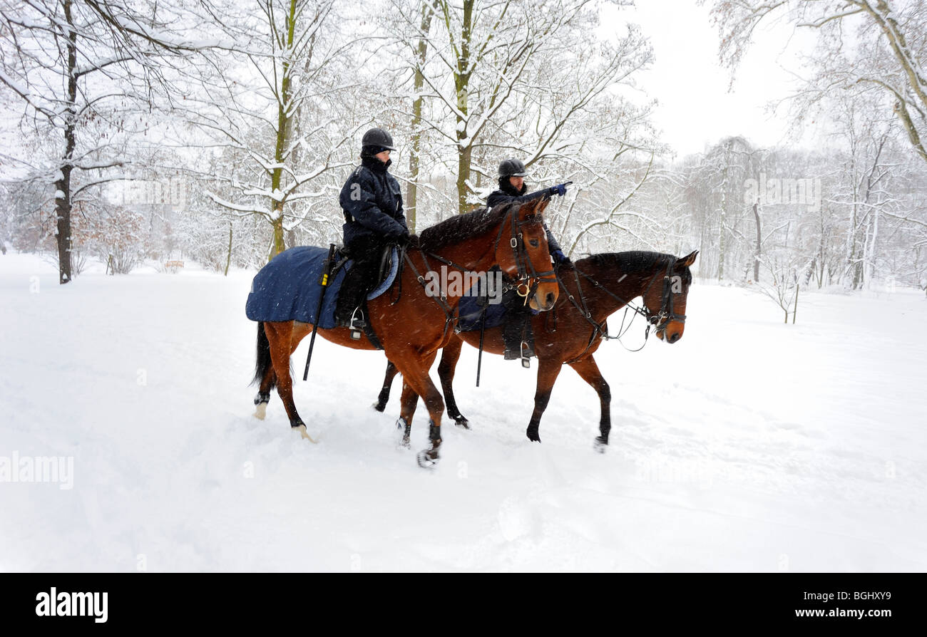 police on horseback in winter park Stock Photo