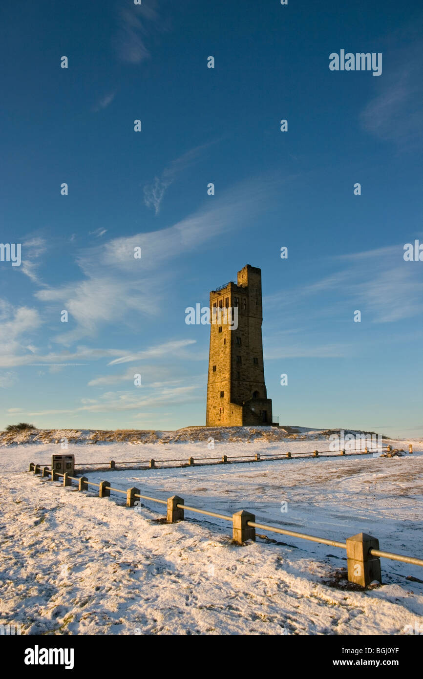 A winter view of Victoria Tower, on Castle Hill, which over looks Huddersfield, West Yorkshire Stock Photo