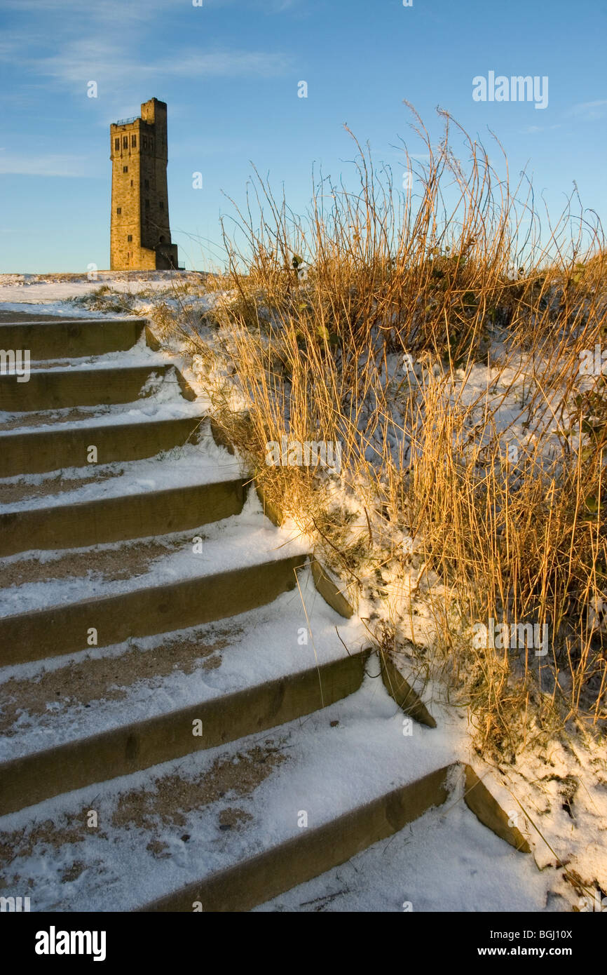 Snow covers the steps that lead up to Victoria Tower, on Castle Hill, which over looks Huddersfield, West Yorkshire Stock Photo