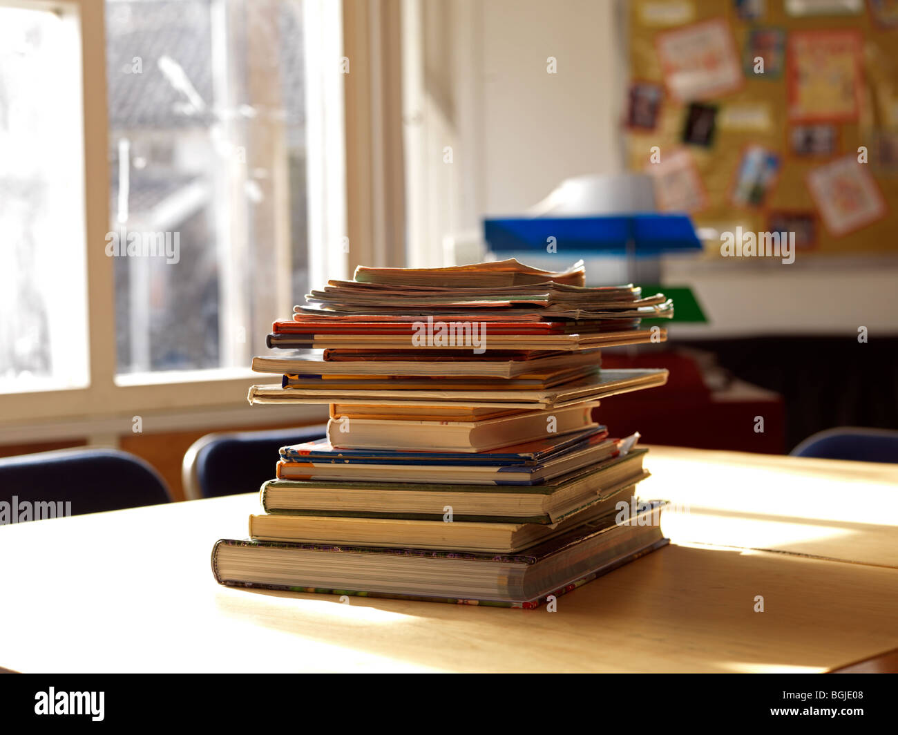 pile of books in classroom Stock Photo Alamy