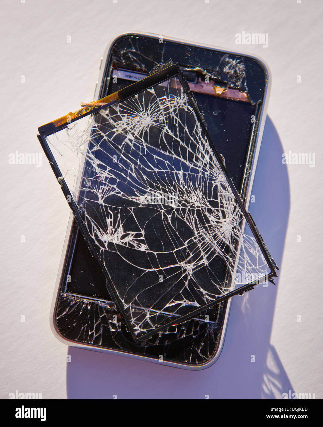 ARLINGTON, VIRGINIA, USA - Damaged Apple iPhone 3G smart phone, with shattered screen. Stock Photo