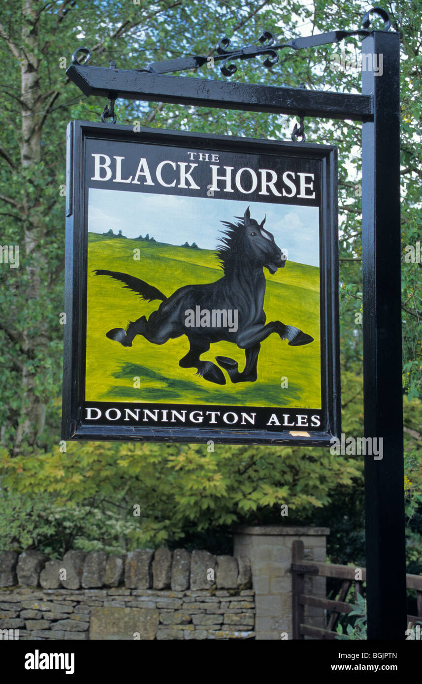 Pub sign for the Black Horse in the Cotswold village of Naunton, Gloucestershire, England Stock Photo