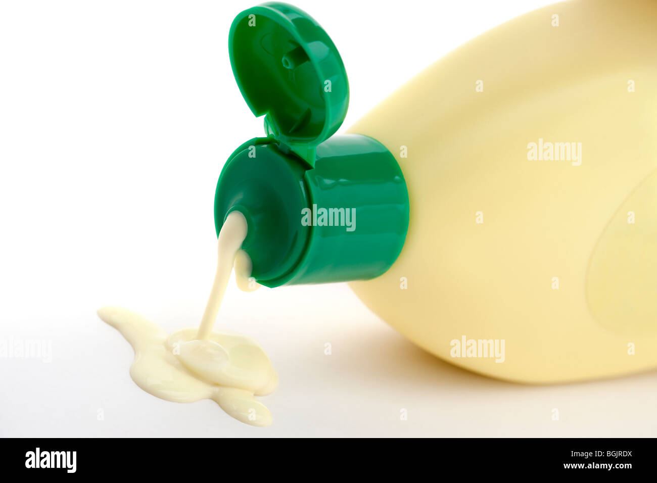 Green plastic open flip top container dripping creme liquid cleanser