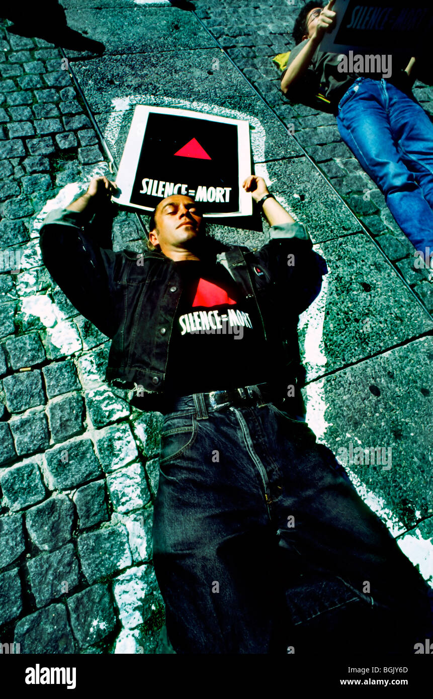 Paris, France - AIDS Activists of Act Up-Paris Protesting Against AIDS, Staging Die-in, Laying Down on Pavement (Credit Photo: Tom Craig) Shirt Slogan, act up poster Stock Photo