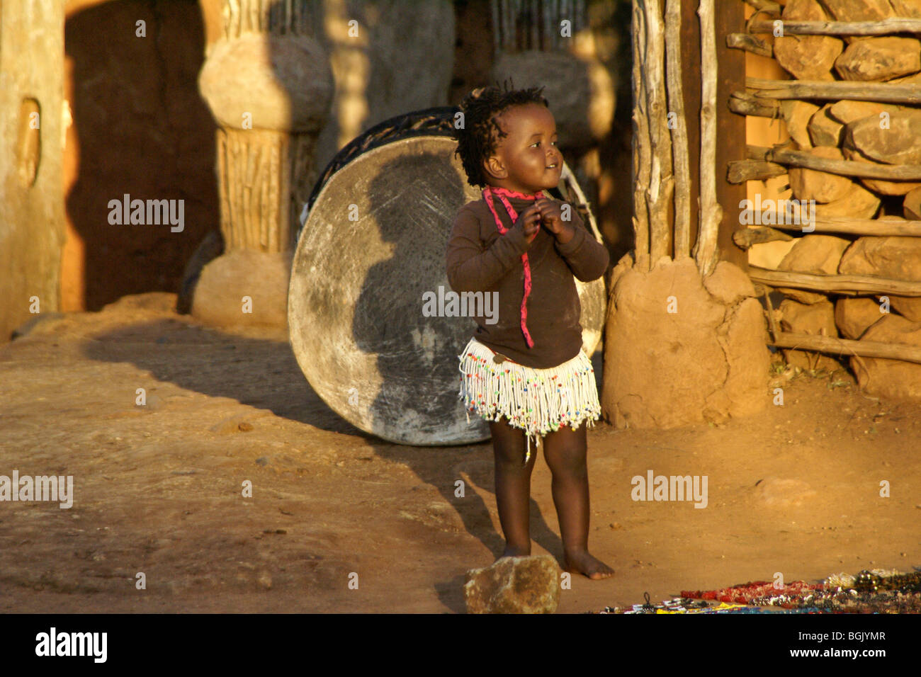 Little Zulu girl and big drum, Shakaland, South Africa Stock Photo Alamy