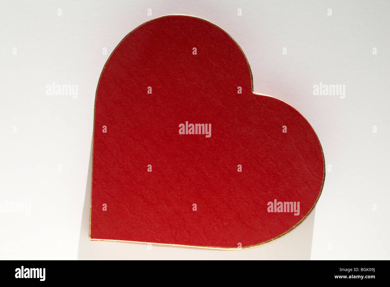 Gold rimmed red heart shaped box - ideal present for Valentines day, Valentine day Stock Photo