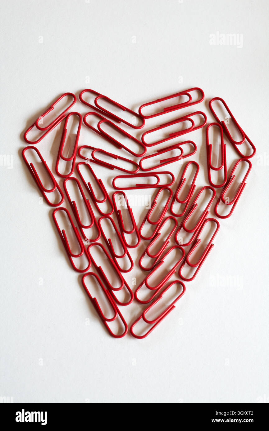 office romance concept - heart of red paper clips, paperclips, isolated on white background Stock Photo