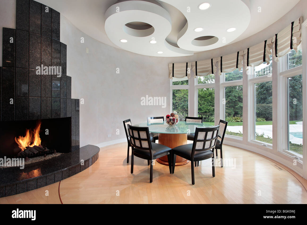 Eating area of luxury home with fireplace Stock Photo