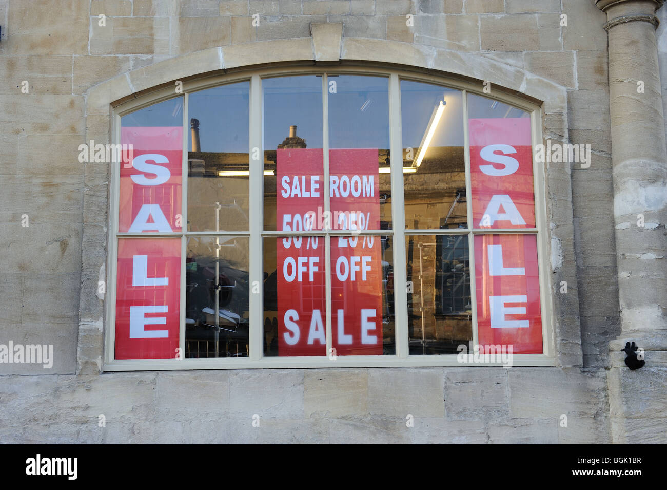 Sale sign flag room shop shops 50 25 percent  off January sales Burford Oxfordshire Cotswolds Stock Photo