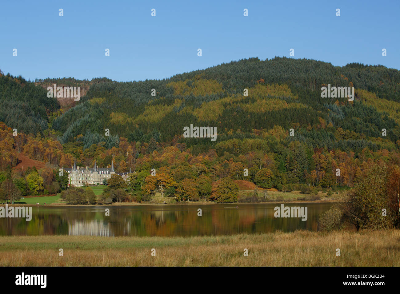 Tigh Mor Holiday Homes, formerly Trossachs Hotel, on Loch Achray in Autumn, Loch Lomond and Trossachs National Park, Stirling, Scotland, UK Stock Photo
