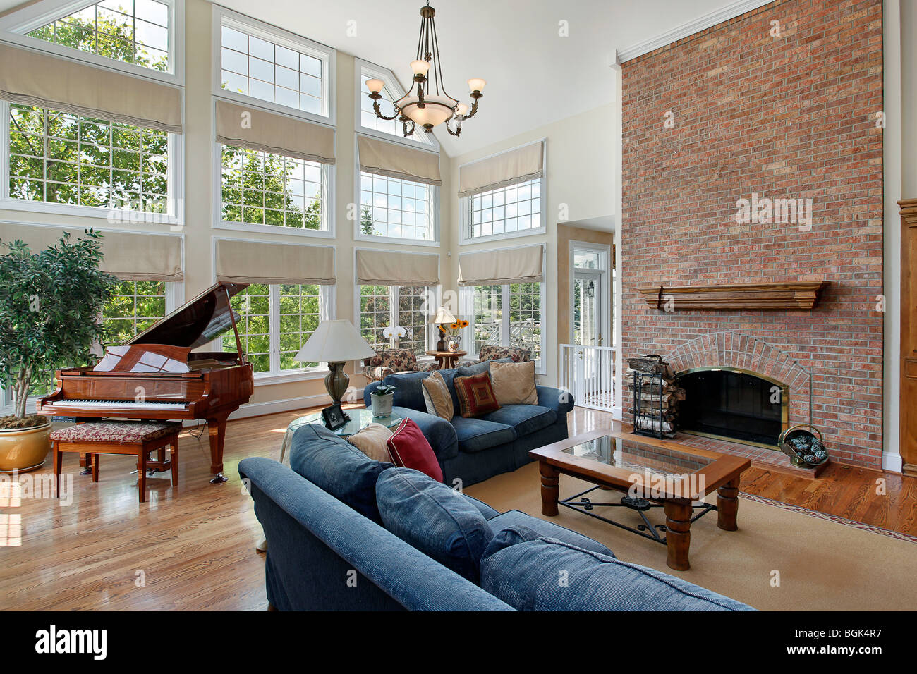 Family room with two story brick fireplace Stock Photo