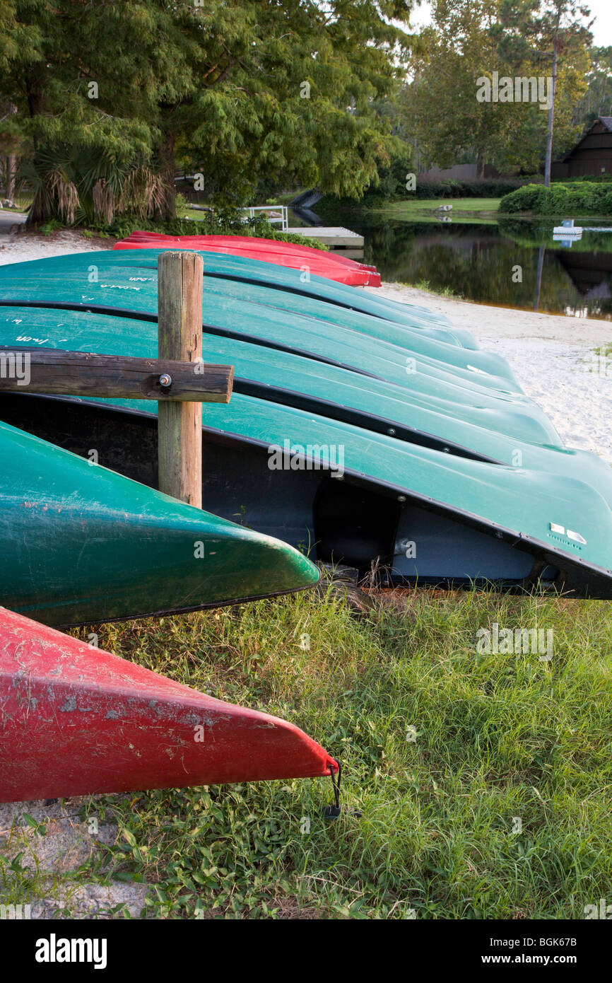 Fiberglass rental canoes stacked waiting for customers at the Meadow