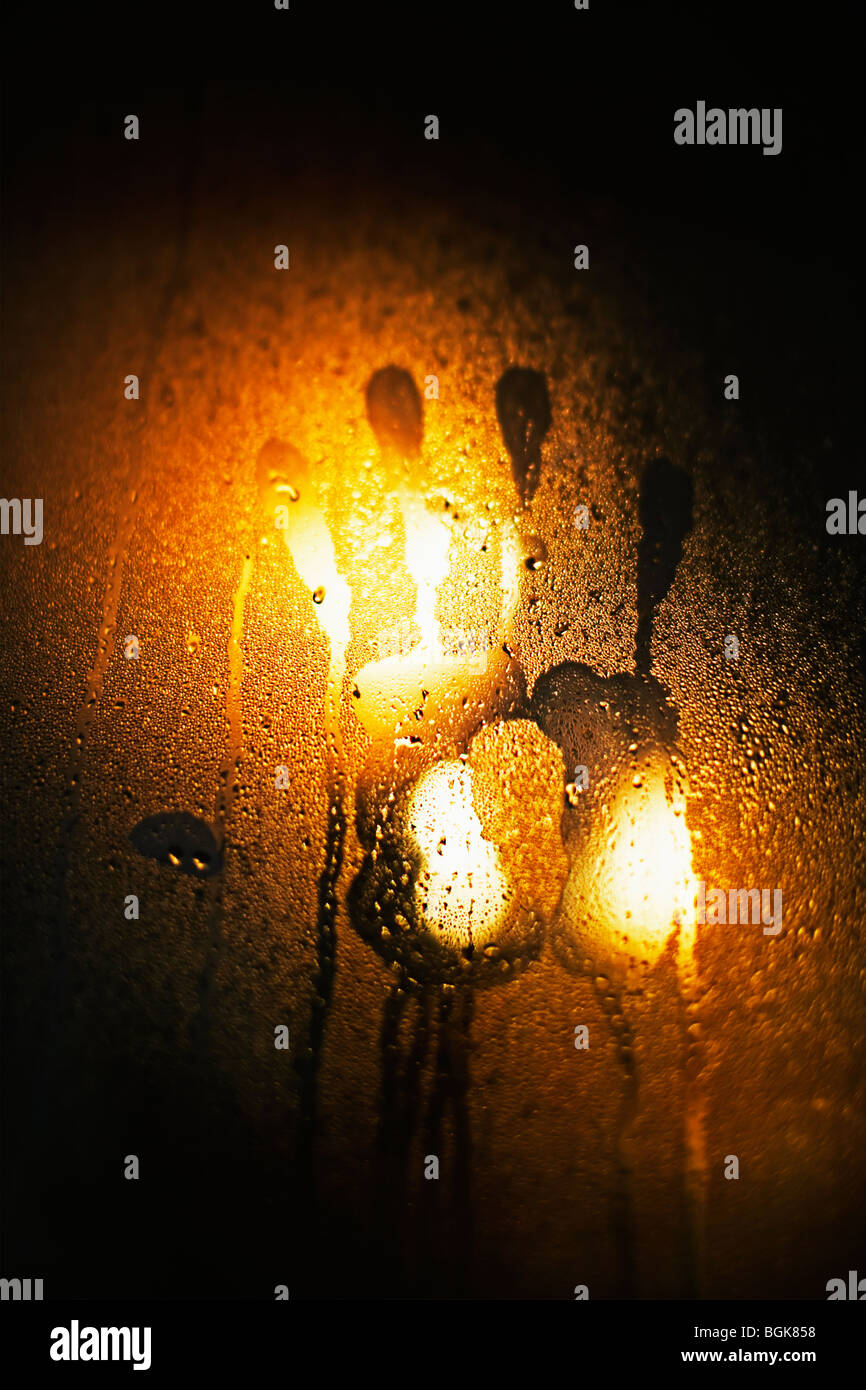 Handprint in the condensation on a window Stock Photo