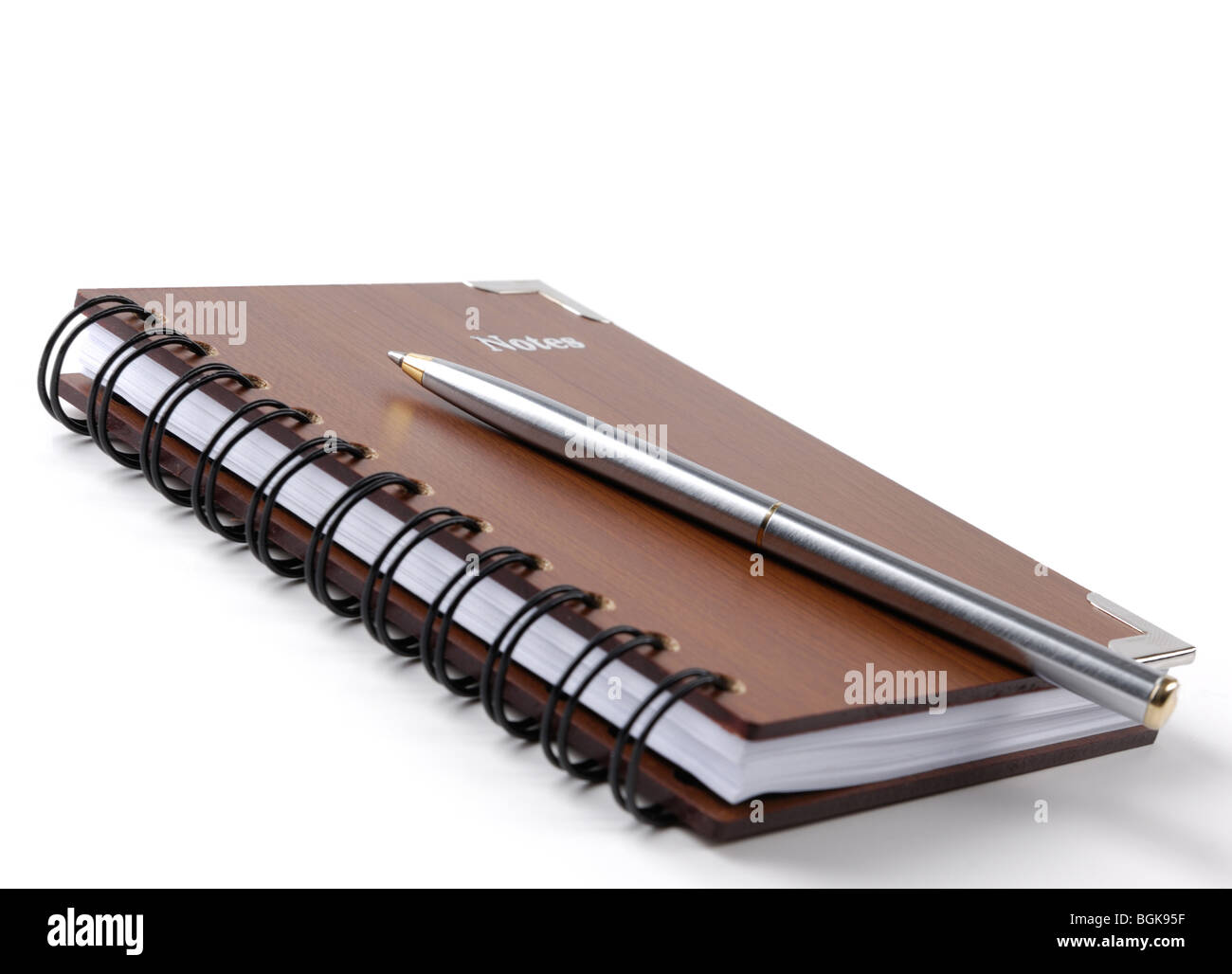 Notepad with a pen isolated on white background Stock Photo - Alamy