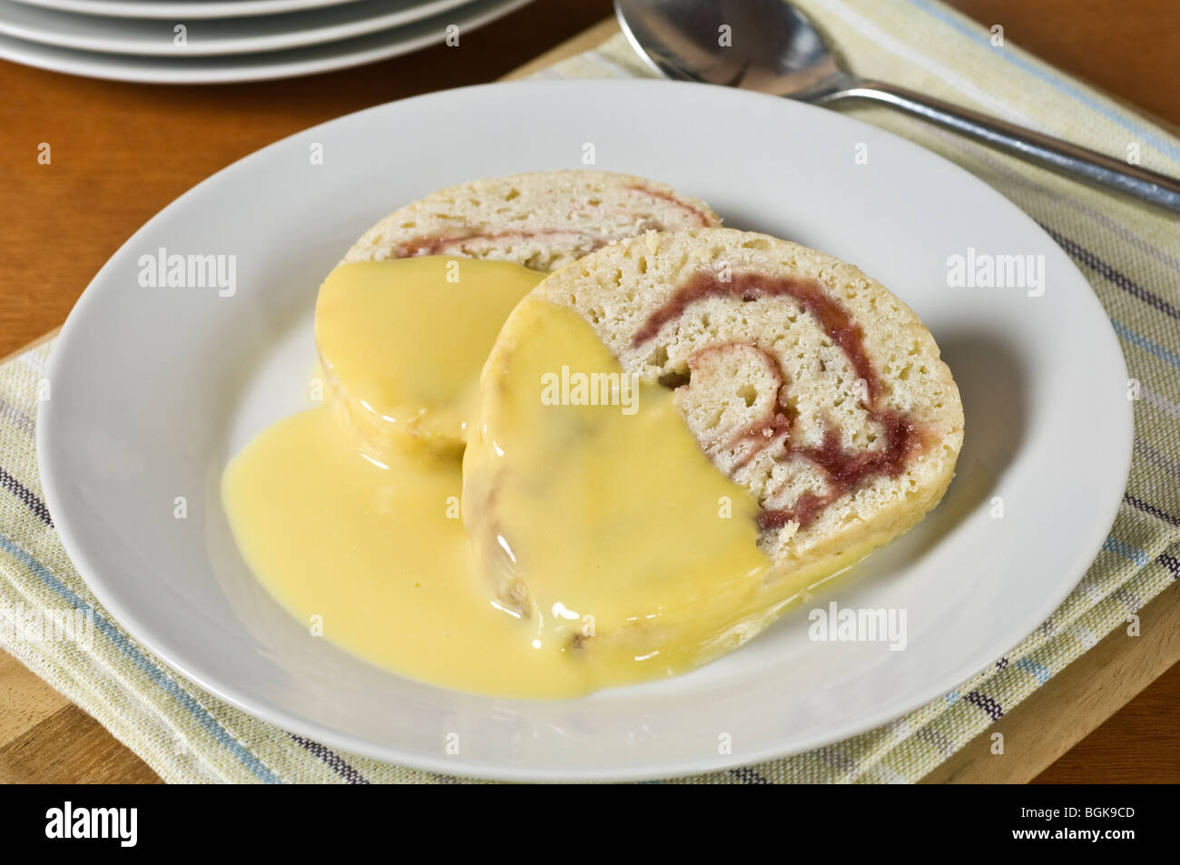 Jam roly poly pudding Stock Photo Alamy