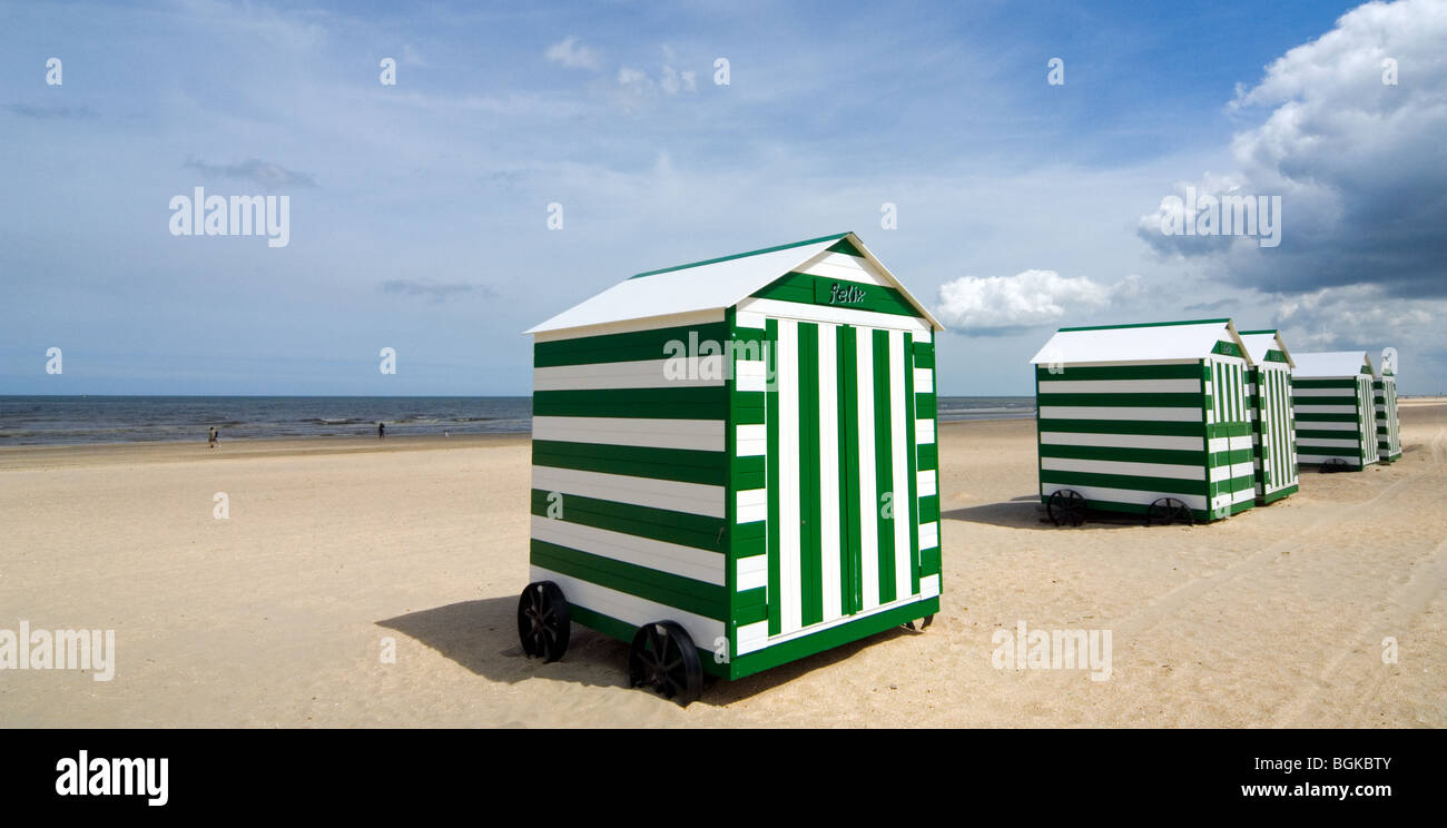 Row Of Colourful White Green Striped Beach Cabins On Wheels Along