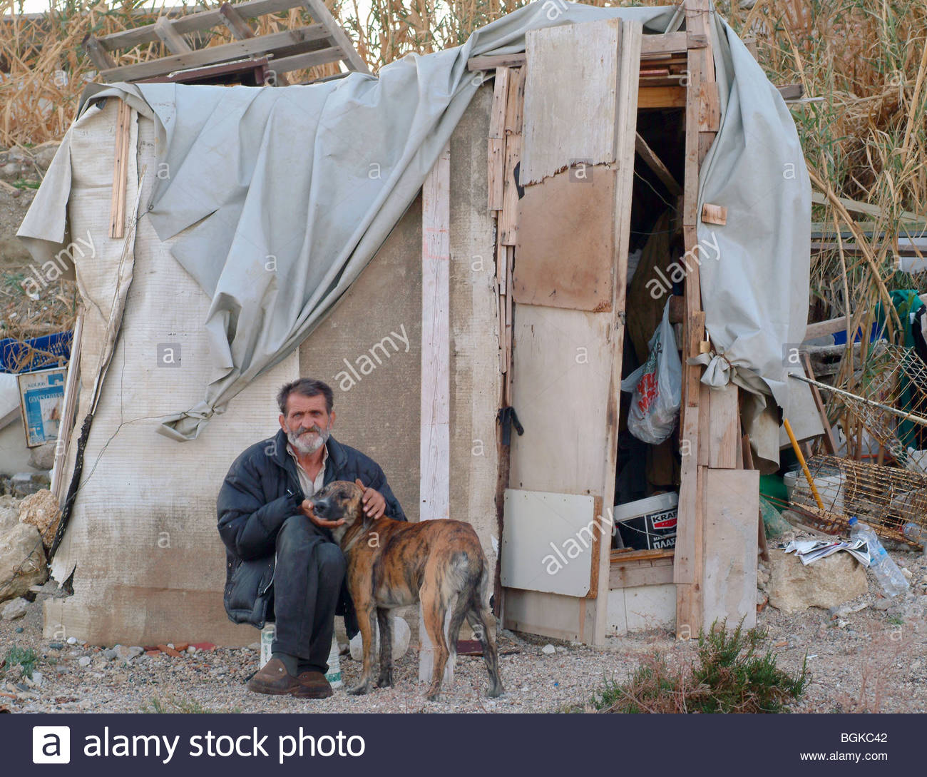 poor-greek-man-living-in-a-home-made-wooden-shack-on-the-beach-in-BGKC42.jpg