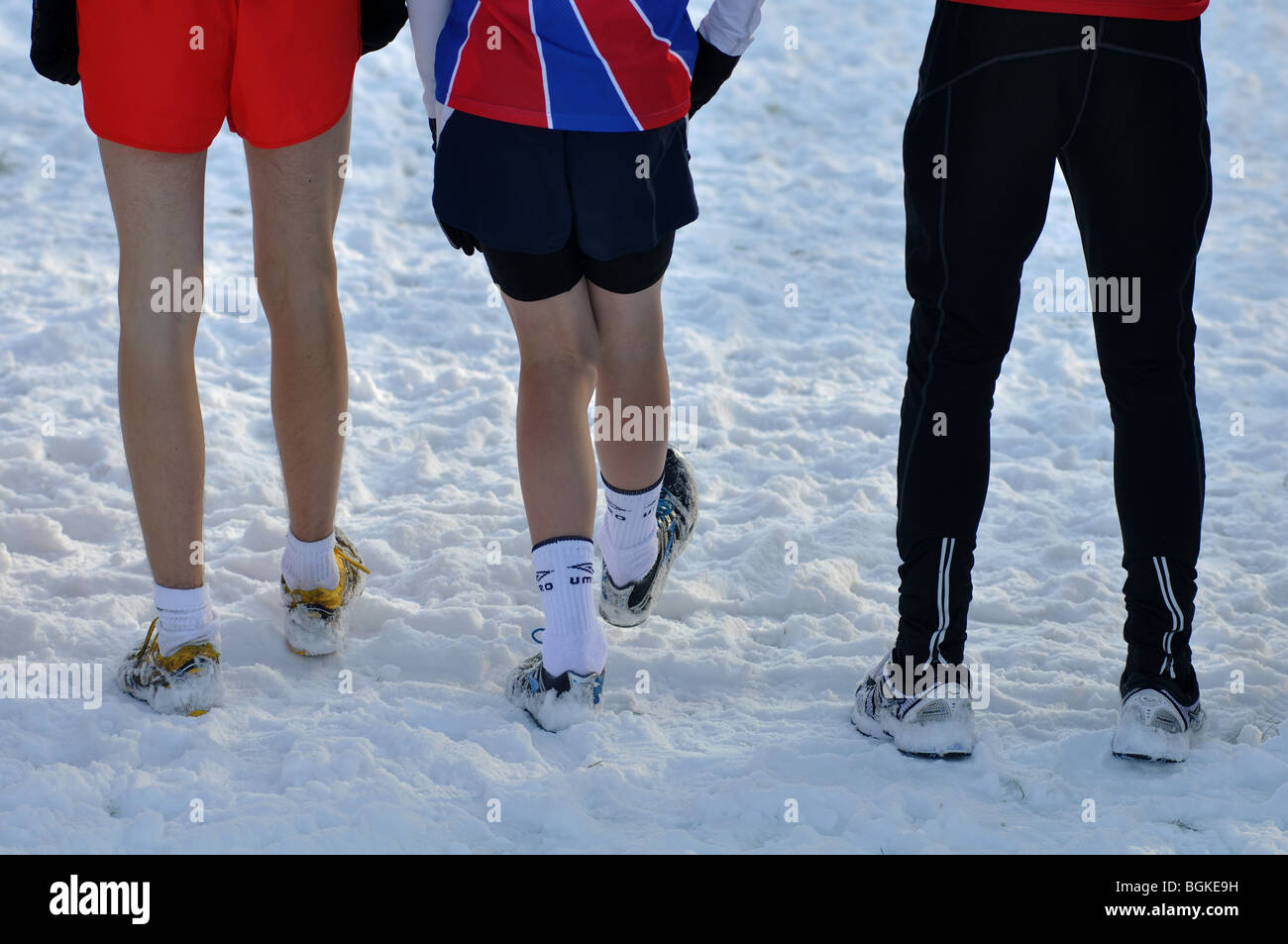 Teenage boys on start line of crosscountry running race standing in