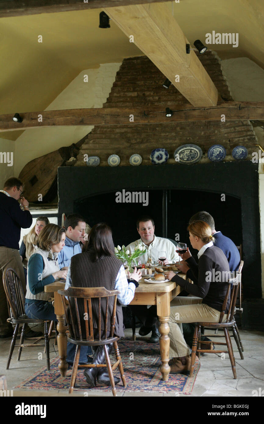 People Eating In A Farmhouse Kitchen Stock Photo