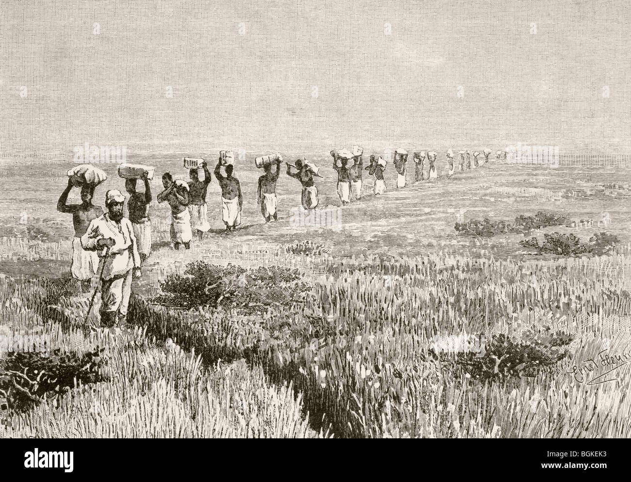 A line of porters carrying expedition supplies during a journey of  exploration in East Africa in the mid 19th century Stock Photo - Alamy