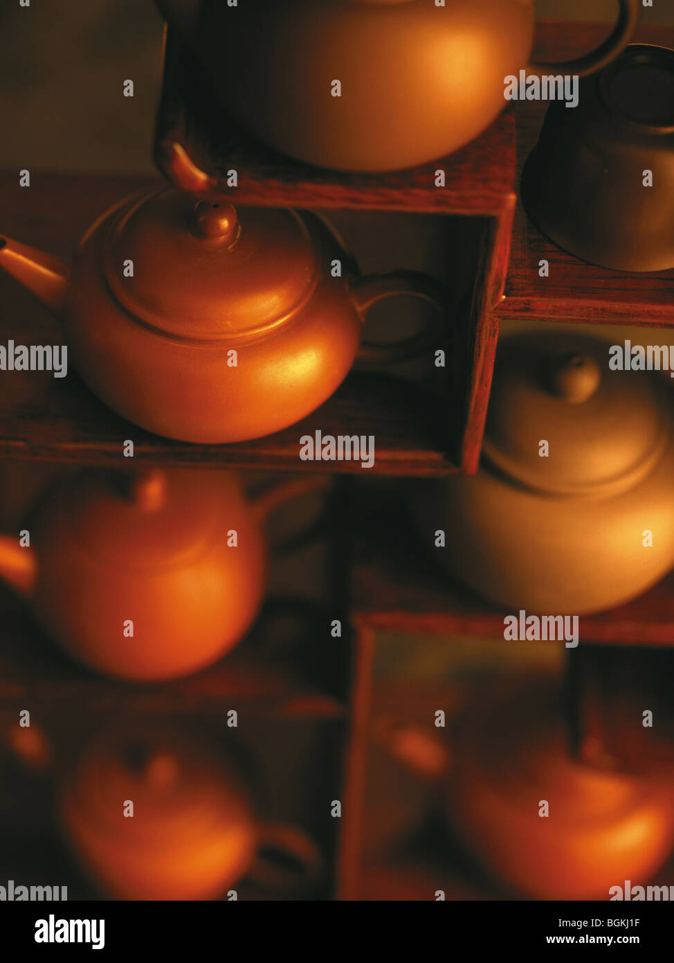 Teapots on wooden shelves Stock Photo