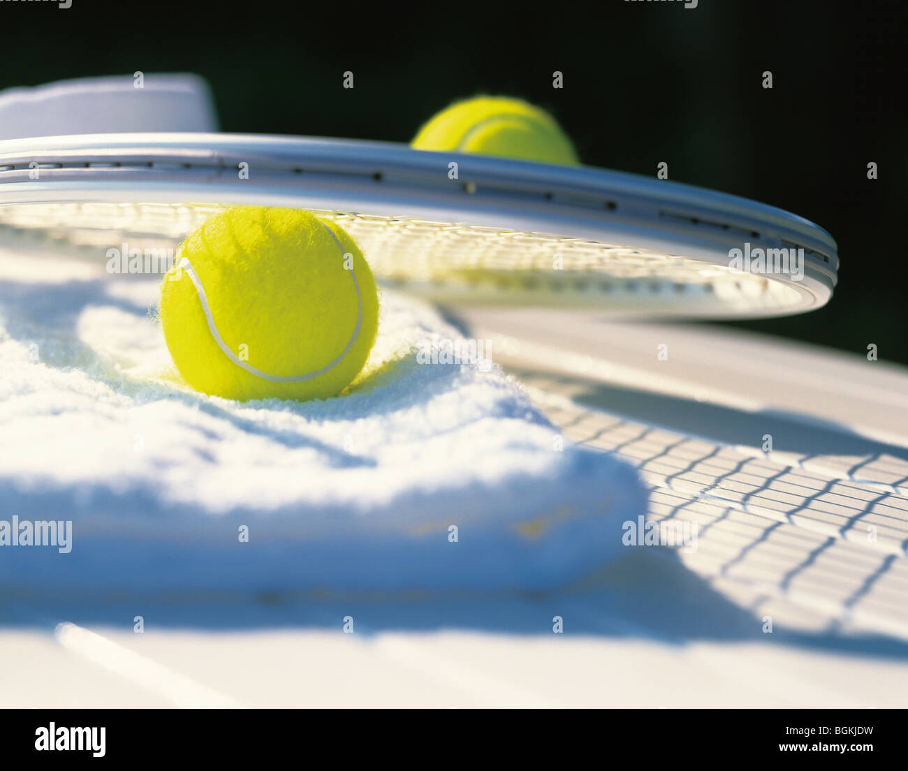 Towel tennis balls and tennis racket Stock Photo
